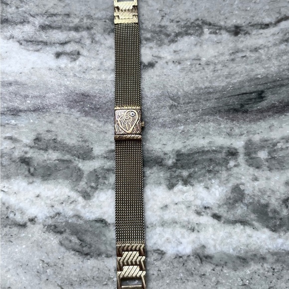 Anne Klein Diamond Collection
Gold Tone Hidden Face Thin
Strap Watch main image 5